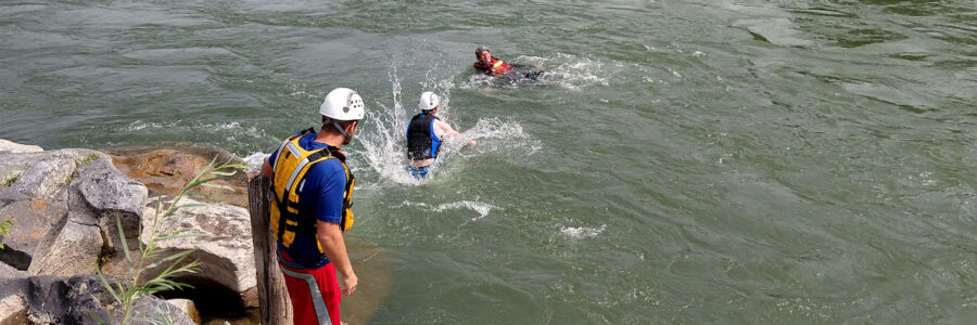 Team members practice swiftwater rescue on the Snake River